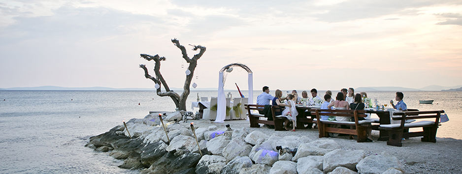 Beach wedding diner at sunset